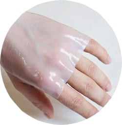 A burn being covered with a soothing pad